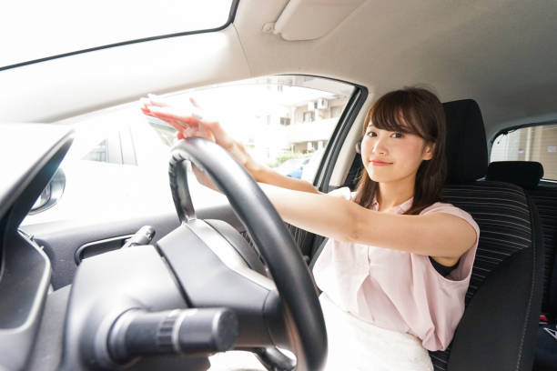 istock Young woman driving a car 843656392
