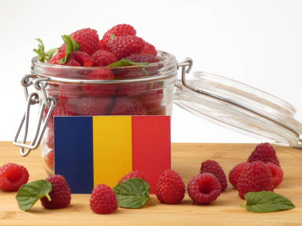 istock Chad flag on a wooden panel with raspberries isolated on a white background 843657112