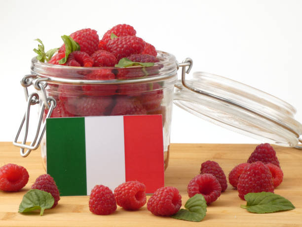 istock Italian flag on a wooden panel with raspberries isolated on a white background 843662294