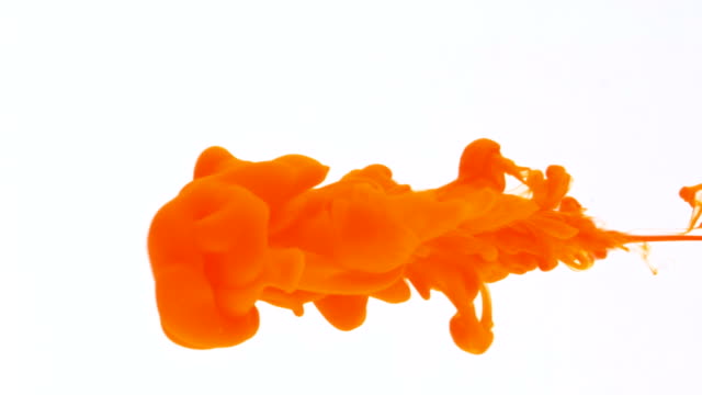 Concept of orange paint ink jet streaming through water and coloring surface abstract background