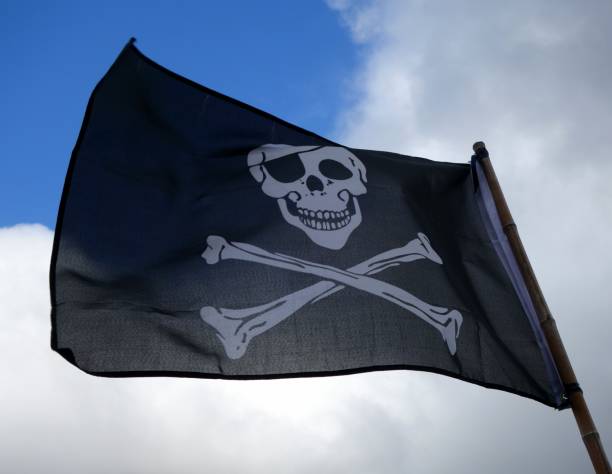 istock Pirate flag waving in the wind 843662688