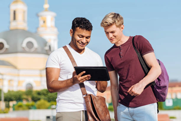 istock Positive brunette man showing his tablet 843666360