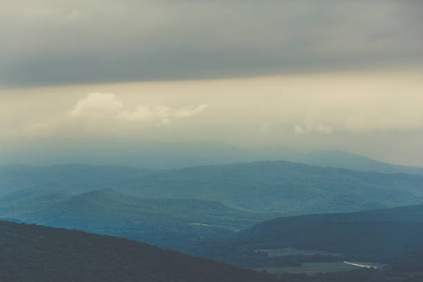 istock Layers of mountain in morning fog 843671696