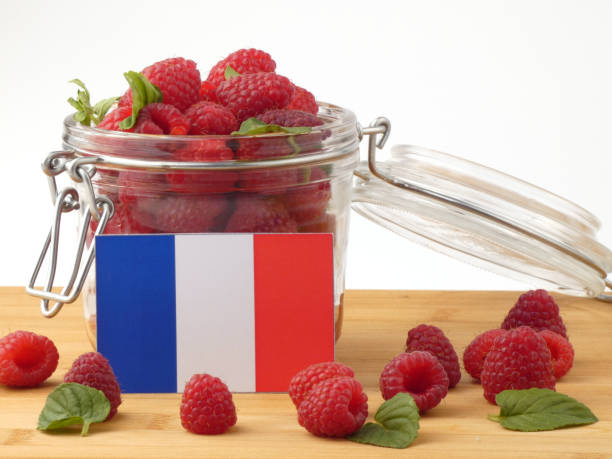 istock French flag on a wooden panel with raspberries isolated on a white background 843672148