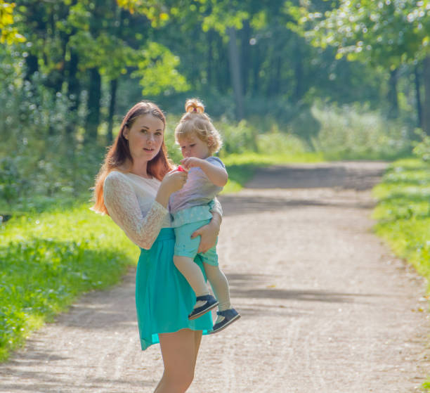 istock on the walk, mother and child in the Park 843673622