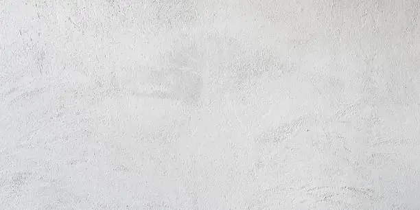 Texture of a white concrete wall for background