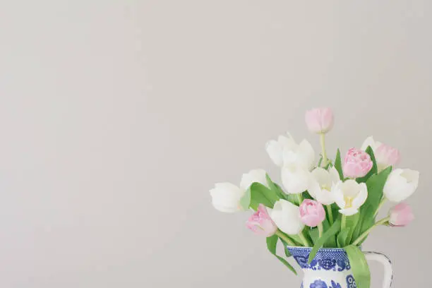 Pink and White Tulips in a vintage chinois pitcher with plenty of negative space