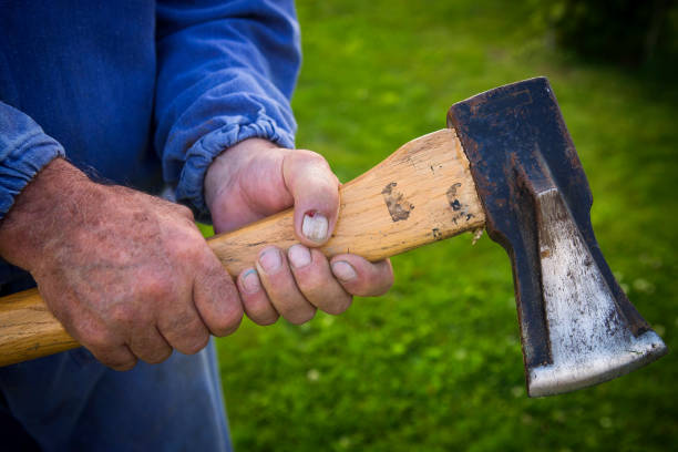 ax in the hands of rough labor - wound blood human finger human hand imagens e fotografias de stock