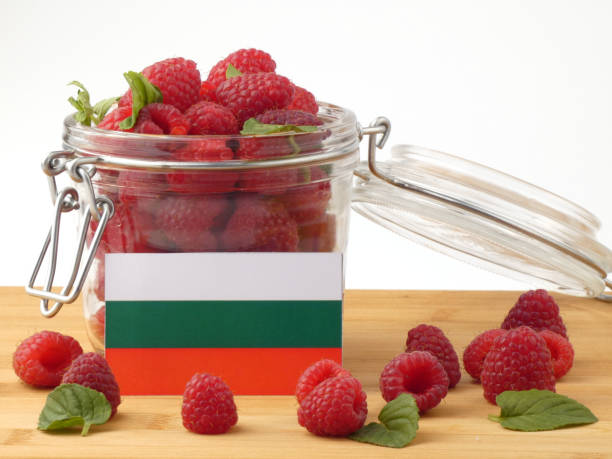 istock Bulgarian flag on a wooden panel with raspberries isolated on a white background 843681536