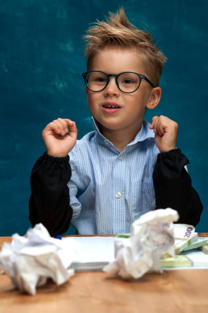 istock Cute child imitating businessperson or bookkeeper 843682038