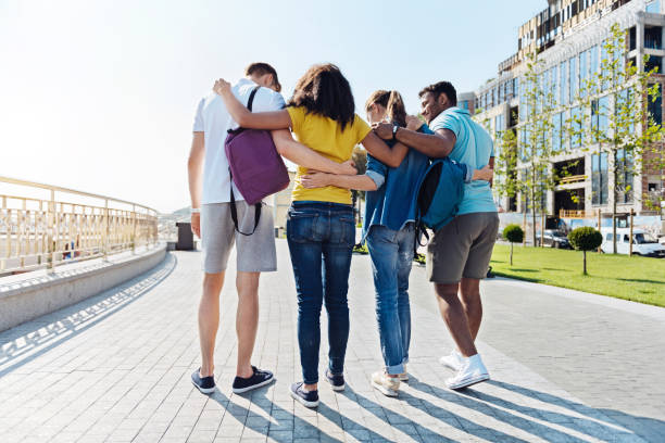 istock Group of friendly students walking through the pass 843686124