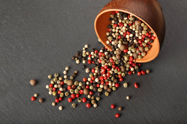 istock pepper in a clay bowl on a slate board 843686158