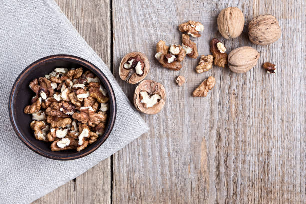 istock walnuts in a bowl on a wooden background 843686324