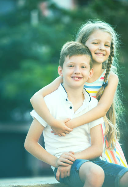 istock girl and boy embracing 843697440