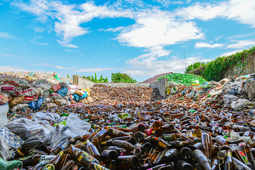 Glass bottles in recycling centre.Particles of crushed shattered glass at a recycling facility in 6 Jan 2014 at chiangrai,thailand