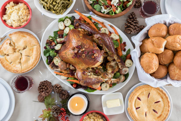 Bird's eye view of a full Christmas dinner table ready for guests