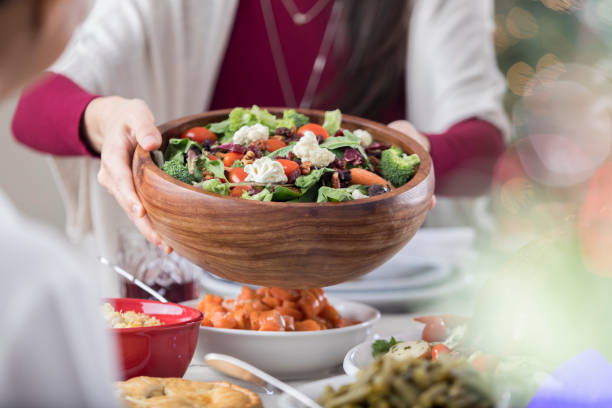 istock Salad is being offered to a Christmas dinner guest 843702502