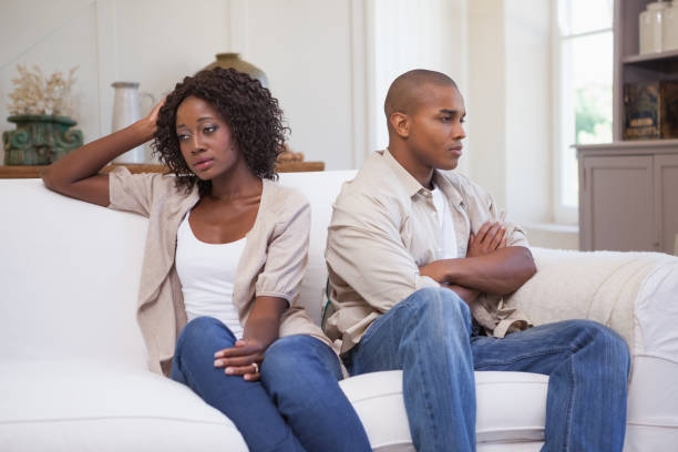 istock Unhappy couple not speaking to each other on sofa 843702552