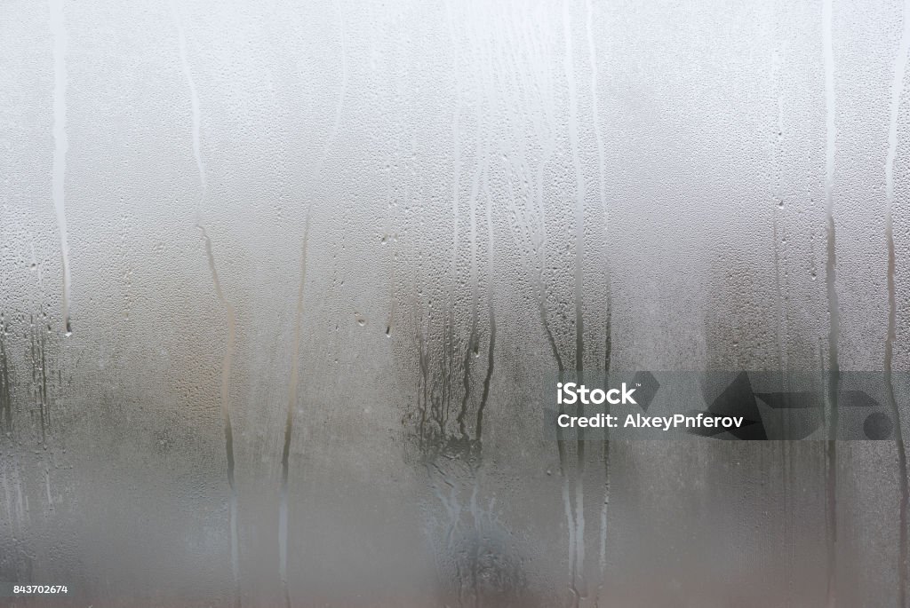 Window with condensate or steam after heavy rain, large texture or background Glass - Material Stock Photo