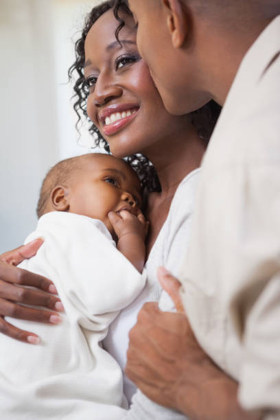 istock Happy parents spending time with baby 843703152