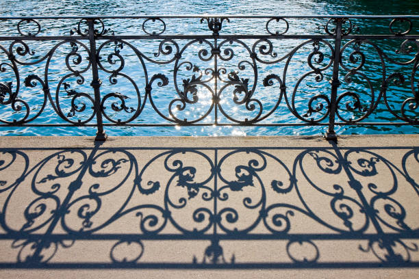 Old wrought iron railing on a walkway in Lucerne (Switzerland) - image with copy space Old wrought iron railing on a walkway in Lucerne (Switzerland) - image with copy space wrought iron stock pictures, royalty-free photos & images