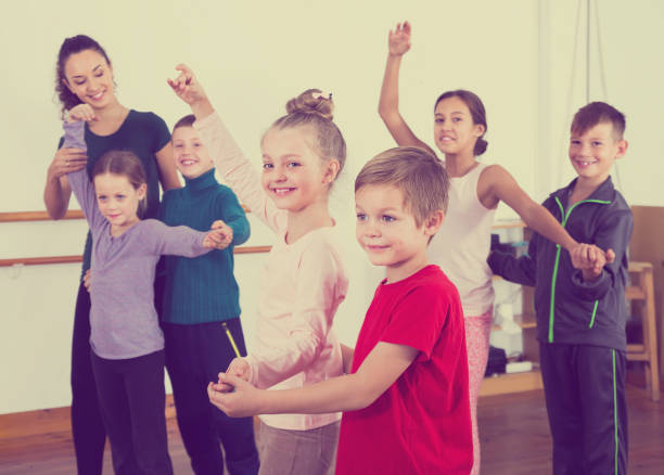 istock vigorous little boys and girls dancing pair dance 843705862