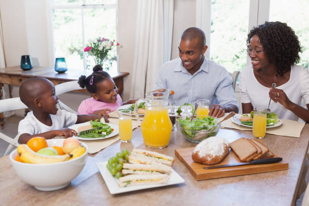 istock Happy family having lunch together 843707186