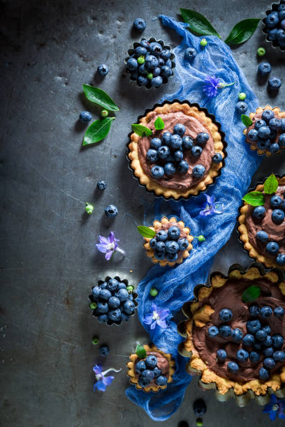 istock Delicious and crispy tarts with fresh blueberries and chocolate 843707680