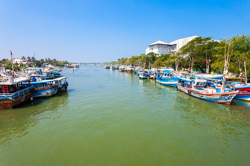 NEGOMBO, SRI LANKA - FEBRUARY 08, 2017: Fishing boats at Negombo dutch canal. Negombo is a major city situated on the west coast of Sri Lanka.
