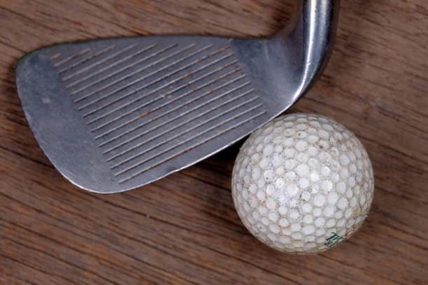 Antique golf club and ball Antique golf club and ball taylormade golf stock pictures, royalty-free photos & images