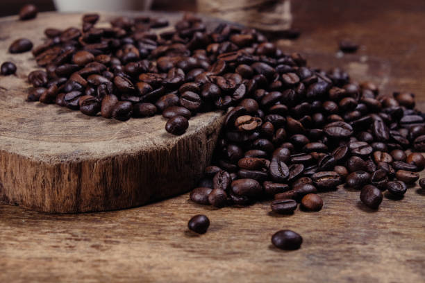 istock Coffee Bean on wood background with filter effect retro vintage style 843720838