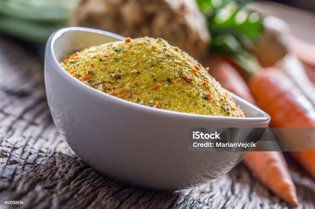 Seasoning spices condiment with dehydrated carrot parsley celery parsnips and salt with or without glutamate Seasoning spices condiment with dehydrated carrot parsley celery parsnips and salt with or without glutamate. Broth Stock Photo