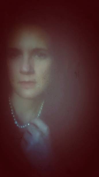 istock Serious Mysterious Woman Touching Pearl Necklace 843735718