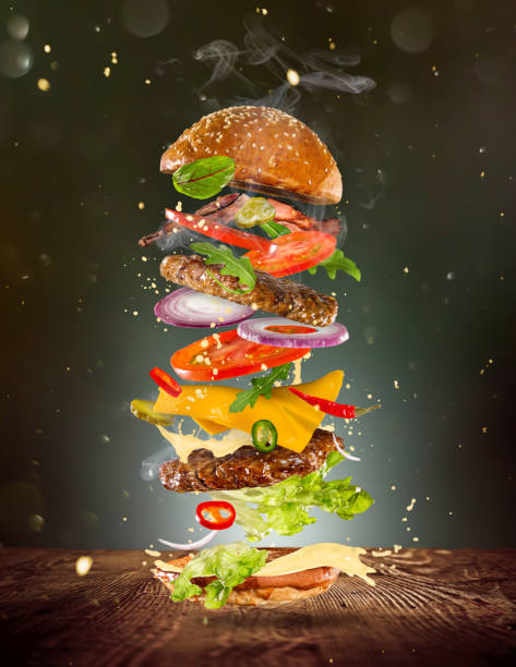 istock Big tasty burger with flying ingredients 843736036