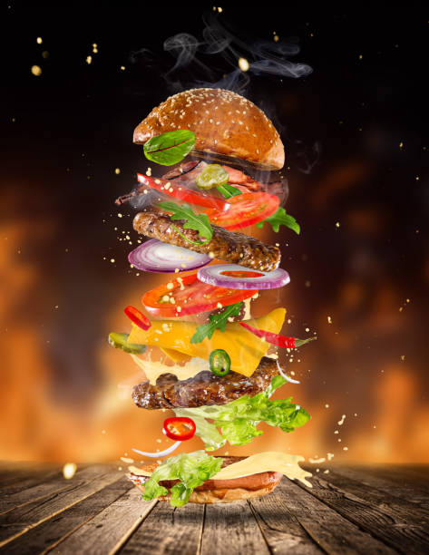 istock Big tasty burger with flying ingredients 843736080