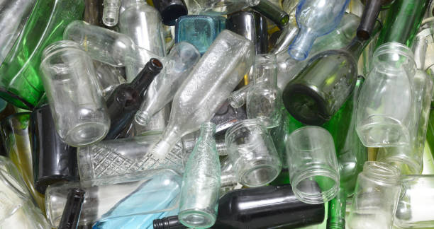 istock Glass bottles inside a glass recycling container 843738154