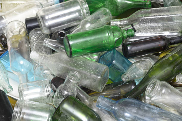 istock Glass bottles inside a glass recycling container 843738188