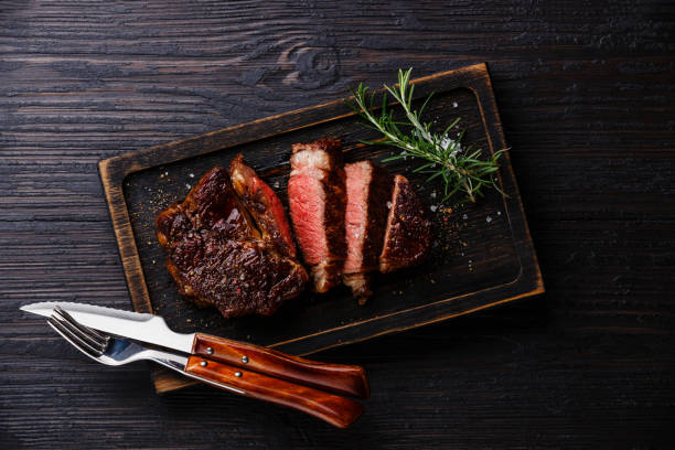 istock Sliced grilled meat barbecue steak Rib eye with knife and fork 843738310