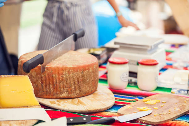 istock a person cut a cheese in the cheese market 843738342