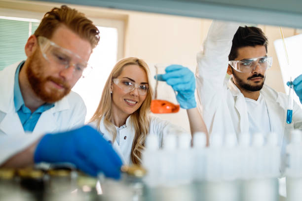 istock Group of chemistry students working in laboratory 843744294