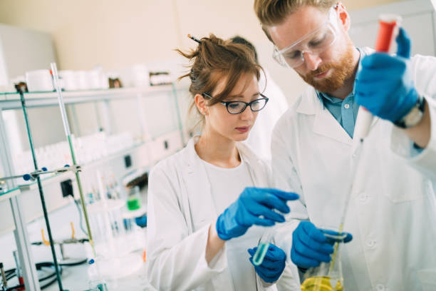 istock Young students of chemistry working in laboratory 843744540