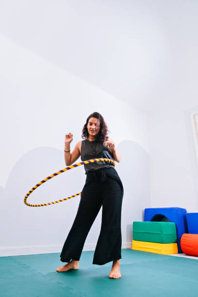 istock Young woman on hula hoop 843744592