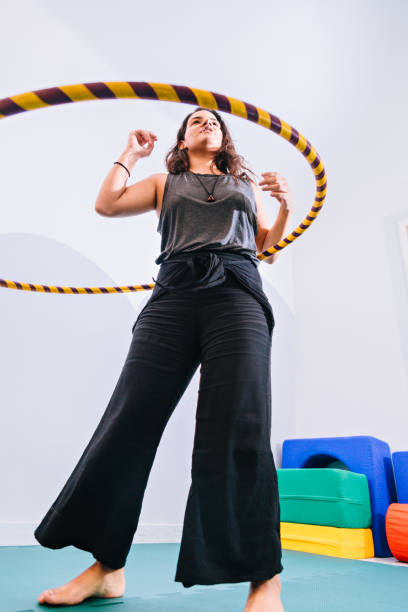 istock Young woman on hula hoop 843744974