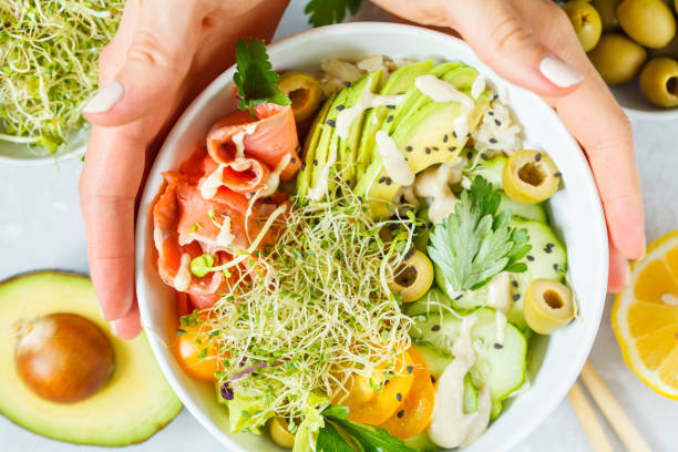 istock salmon poke with rice, avocado and sprouts. 843745400