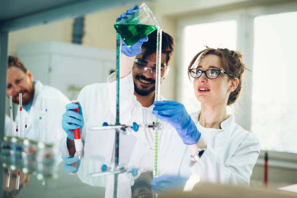 istock Young students of chemistry working in laboratory 843748006