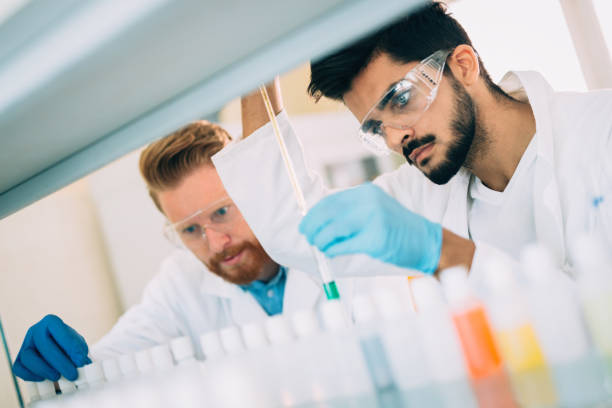 istock Young students of chemistry working in laboratory 843749300
