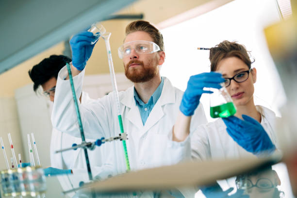 istock Young students of chemistry working in laboratory 843751462