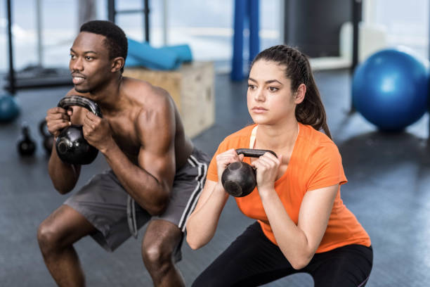 istock Athletic man and woman working out 843751774
