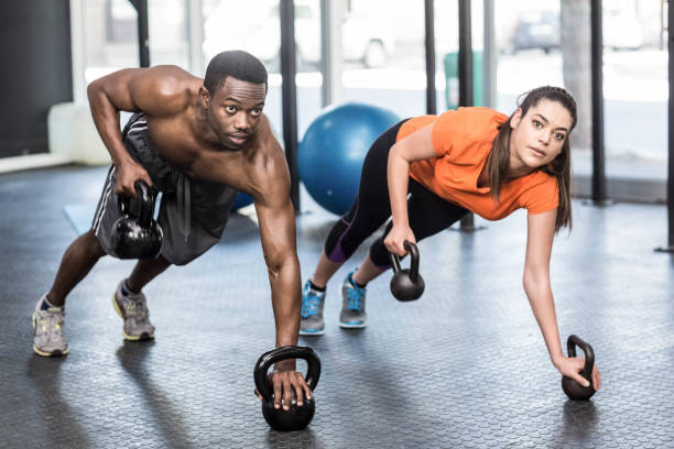 istock Athletic man and woman working out 843751864