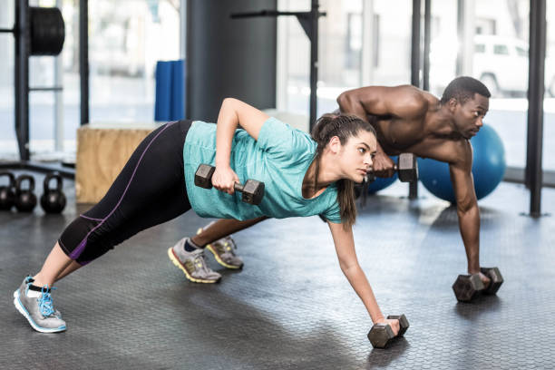 istock Athletic man and woman working out 843752022